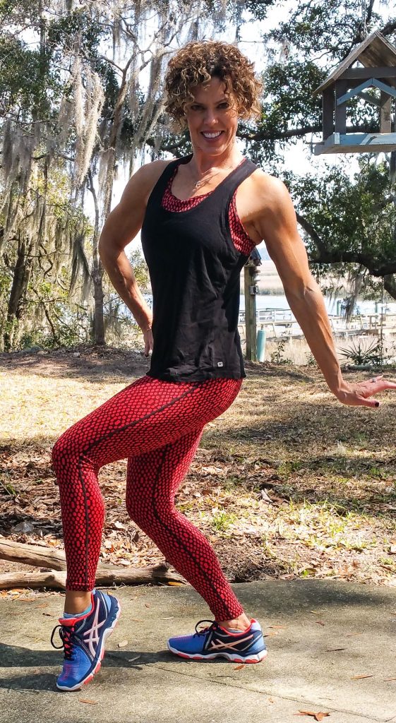 GG dancing in her backyard with the water view behind