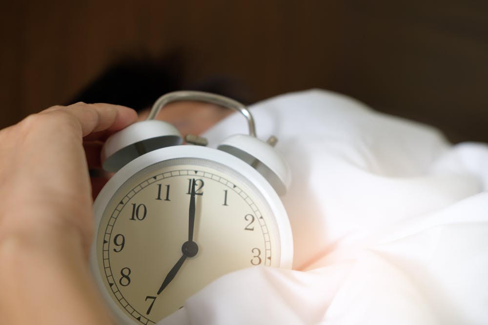 Clock with white sheets around it